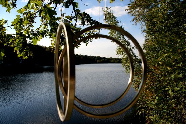 lakechimes.jpg - A view of the Lake through some wind chimes..